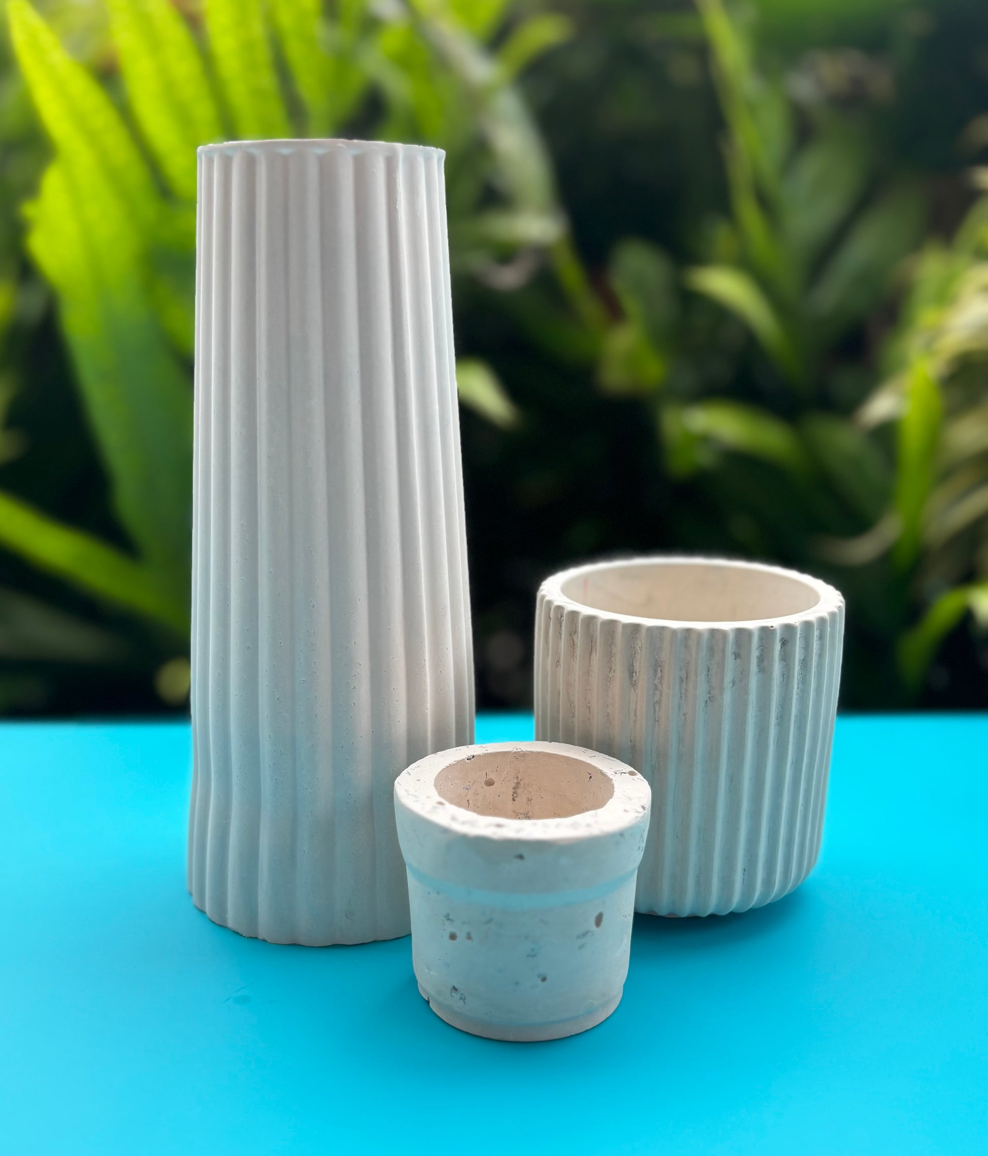 Small white concrete vase